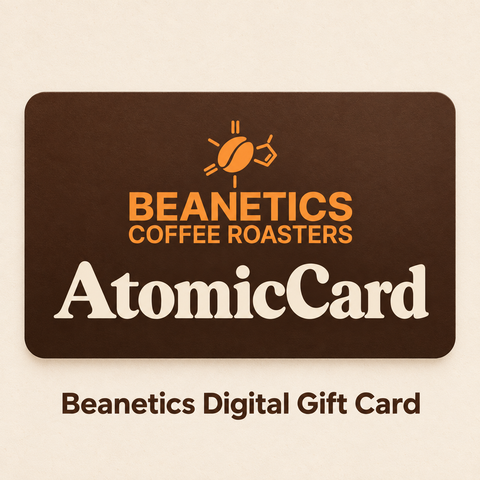 Beanetics AtomicCard digital gift card with orange Beanetics logo on an espresso-brown card and warm cream background.